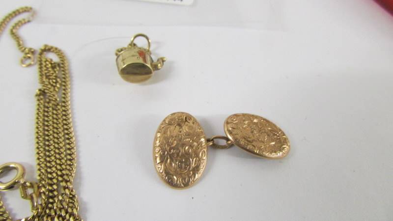 A 9ct gold chain, a gold cuff link and a gold kettle charm, 8.5 grams. - Image 3 of 3