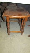 A small oak drop side table. Collect only.