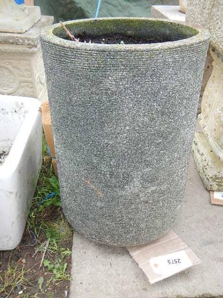 A circular tub planter. 51 cm tall x 35 cm diameter. Collect only.