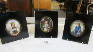 Three hand-painted miniature portraits on porcelain.