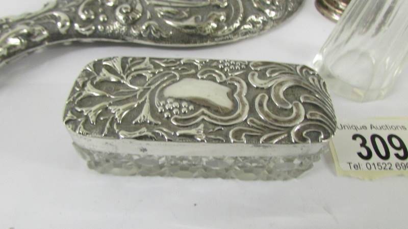 A silver backed hand mirror, a silver topped trinket pot, a silver spill vase and a silver topper - Image 2 of 4