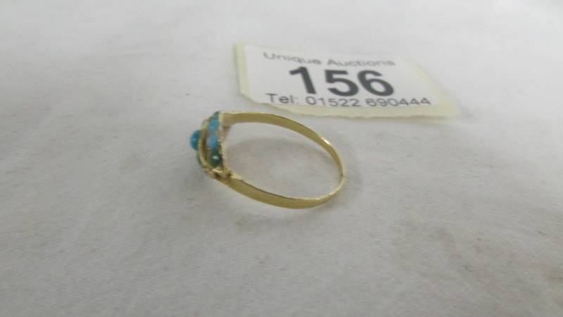 A turquoise set ring, size R. (tests as gold) - Image 2 of 2