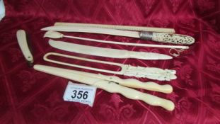 An antique ivory page turner (a/f) glove stretchers, ruler, cut throat razor, paperknife and book