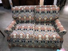 A 2 seater sofa with Art nouveau pattern