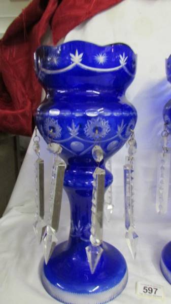 A pair of blue glass overlaid lustre's, (two droppers a/f and one dropper missing). 36 cm tall. - Image 2 of 4