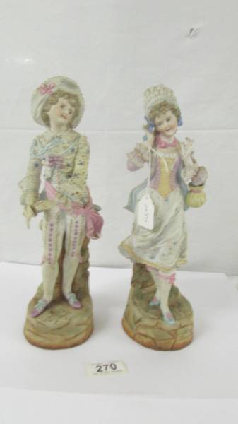 A pair of 19th century figurines, marked KPM with crossed swords. No damage of visible signs of