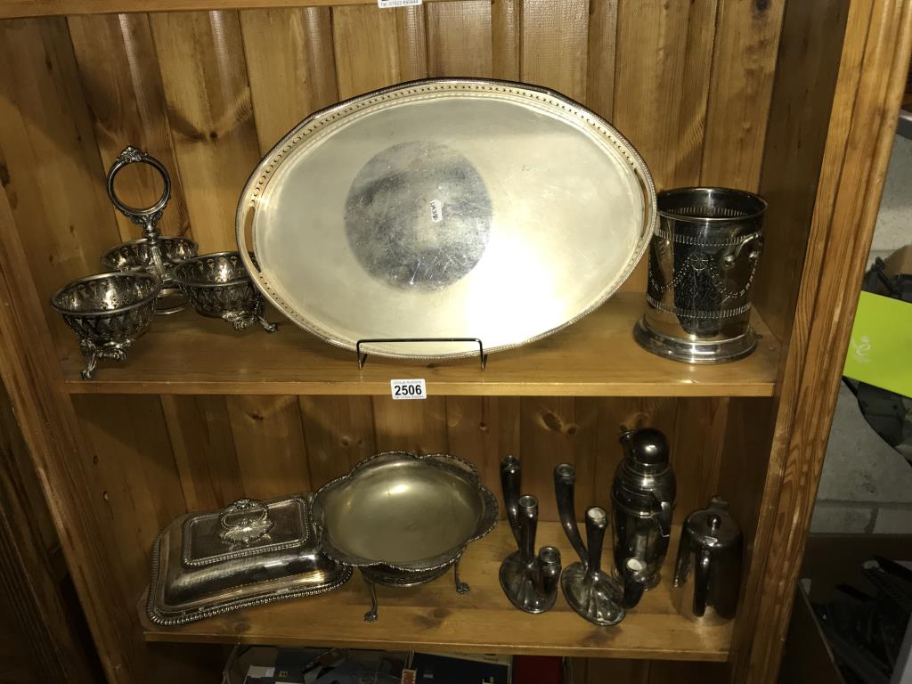 A selection of silver plate, serving tray, candlesticks, tankards etc.