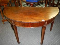 A mahogany D shaped occasional table.