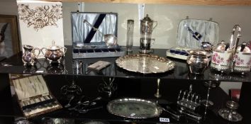 2 shelves of assorted chrome 7 silver plate including cutlery, tray & condiment sets etc. Collect