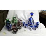 Five coloured glass vases decorated with silver and a blue glass decanter with 6 glasses also