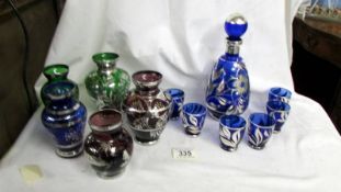 Five coloured glass vases decorated with silver and a blue glass decanter with 6 glasses also