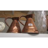 A good pair of copper jugs.