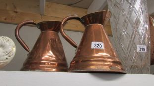 A good pair of copper jugs.
