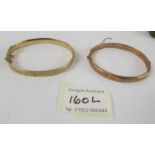 Two 9ct gold bangles, 26.5 grams (one has dents).