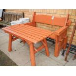 A brown painted garden bench and table. Collect only.