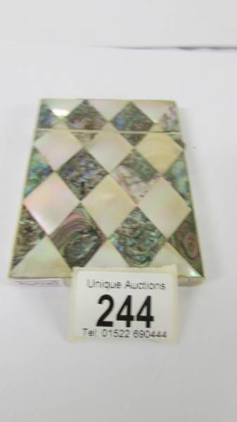 A mother of pearl and abalone card case.
