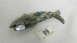 A paua shell articulated fish.