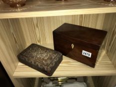 A Victorian mahogany tea caddy on brass ball feet and a carved cigarette box