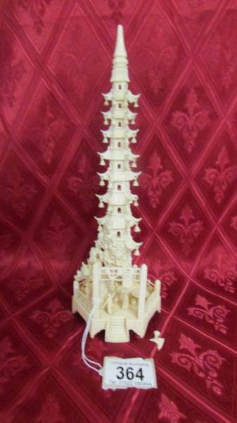 An antique carved ivory pagoda. a/f. Available for UK shipping only.