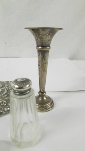 A silver backed hand mirror, a silver topped trinket pot, a silver spill vase and a silver topper - Image 4 of 4