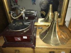 A gramophone with HMV lable and brass horn (missing elbow)