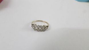 An 18ct all over yellow gold diamond ring, size L. Weight 1.8g