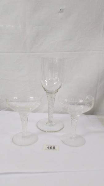 A twist stem goblet and a pair of twist stem cocktail glasses.