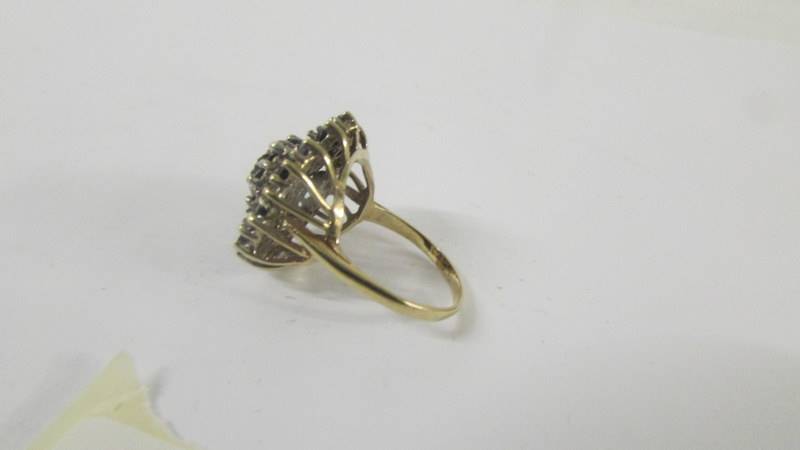 A large yellow gold sapphire and diamond ring, size O. - Image 6 of 6