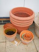 A Quantity of small terracotta plant pots and 4 large plastic plant pots, collect only.