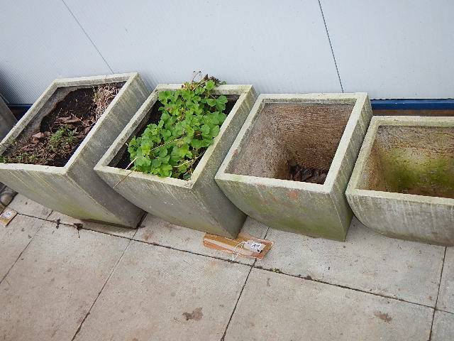 A set of 4 graduated square fibre glass pots. Collect only.