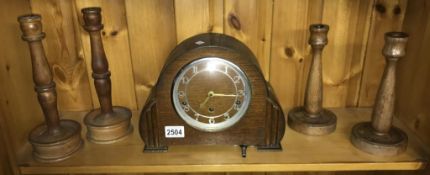 An Art Deco good working Westminster chime clock with winding key and 2 pairs of turned wood