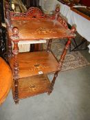 A Victorian mahogany inlaid three shelf stand. Collect only.