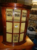A bow front corner shop cabinet with Fry's & Son Ltd., Bristol signing. Collect only.