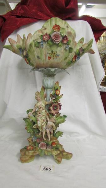 A continental porcelain bowl on figural bowl, circa 19th-century, 44 cm tall, a/f (repair to rim).