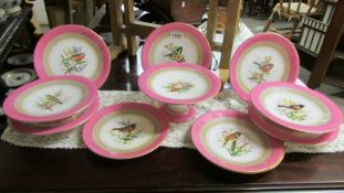 A Royal Worcester hand painted dessert set comprising 5 comports and 6 plates decorated with flowers
