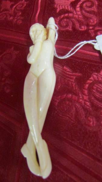An antique ivory Japanese female medical figurine. Available for UK shipping only.