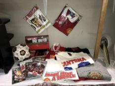 A selection of Manchester United memorabilia including shirts, DVD's & football etc.