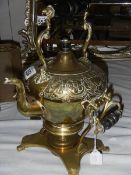 A brass spirit kettle on stand.