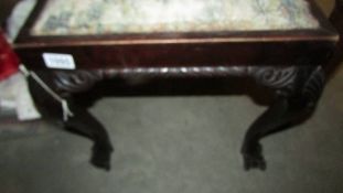 A Victorian mahogany stool.