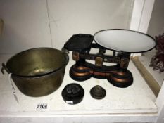 A Victorian brass jam pan & a cast iron set of kitchen scales. Collect only.