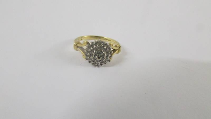 A 18ct floral diamond ring with two diamonds on sides. size H. Weight 3.8g - Image 2 of 6