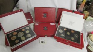 Nine deluxe UK uncirculate coin sets with four £5 coins, years 1986, 87, 88, 90, 91, 96, 98, 99