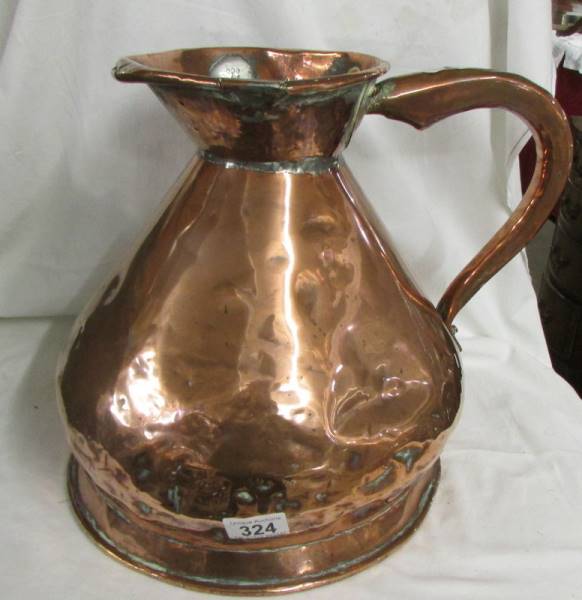 A large copper two gallon jug. Collect only.