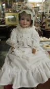 A 19th-century porcelain headed doll by Armande Marsielle, 390n, SRCM, 246/1, 11M on back of neck.