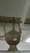 A tall Middle Eastern copper coffee pot. Collect only.