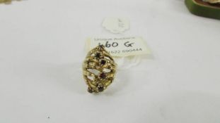 A 9ct gold ring set garnets, size N. 7.8 grams.