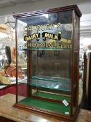 A late Victorian cabinet with later Cadbury signing. (two shelves)