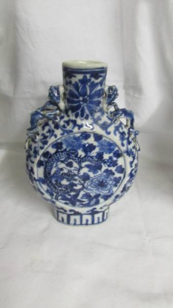 A pair of early Chinese blue and white lidded vases (both lids a/f) and a blue and white flask. - Image 8 of 25