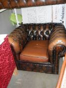 A deep buttoned Chesterfield style chair. Collect only.