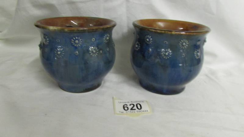 A pair of small Royal Doulton pots, 9cm tall.